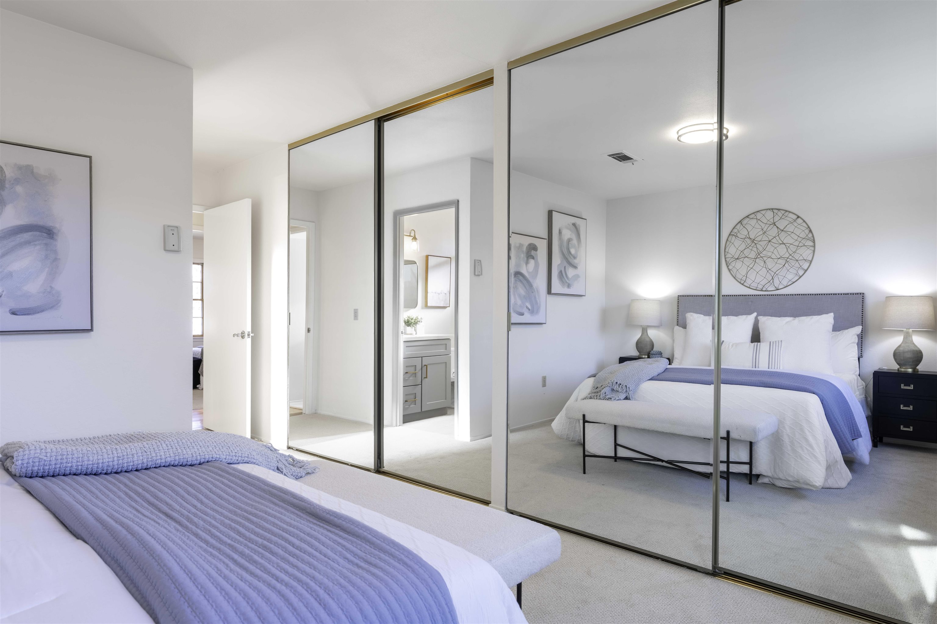 20 Fircrest Court San Ramon, CA 94583 - Photo 23 of 38 a bedroom with a bed lamp and a large mirror