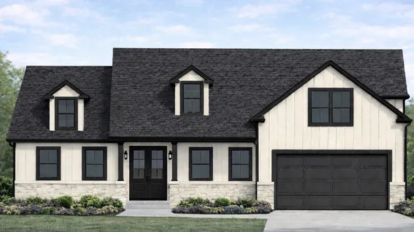 a front view of a house with garage