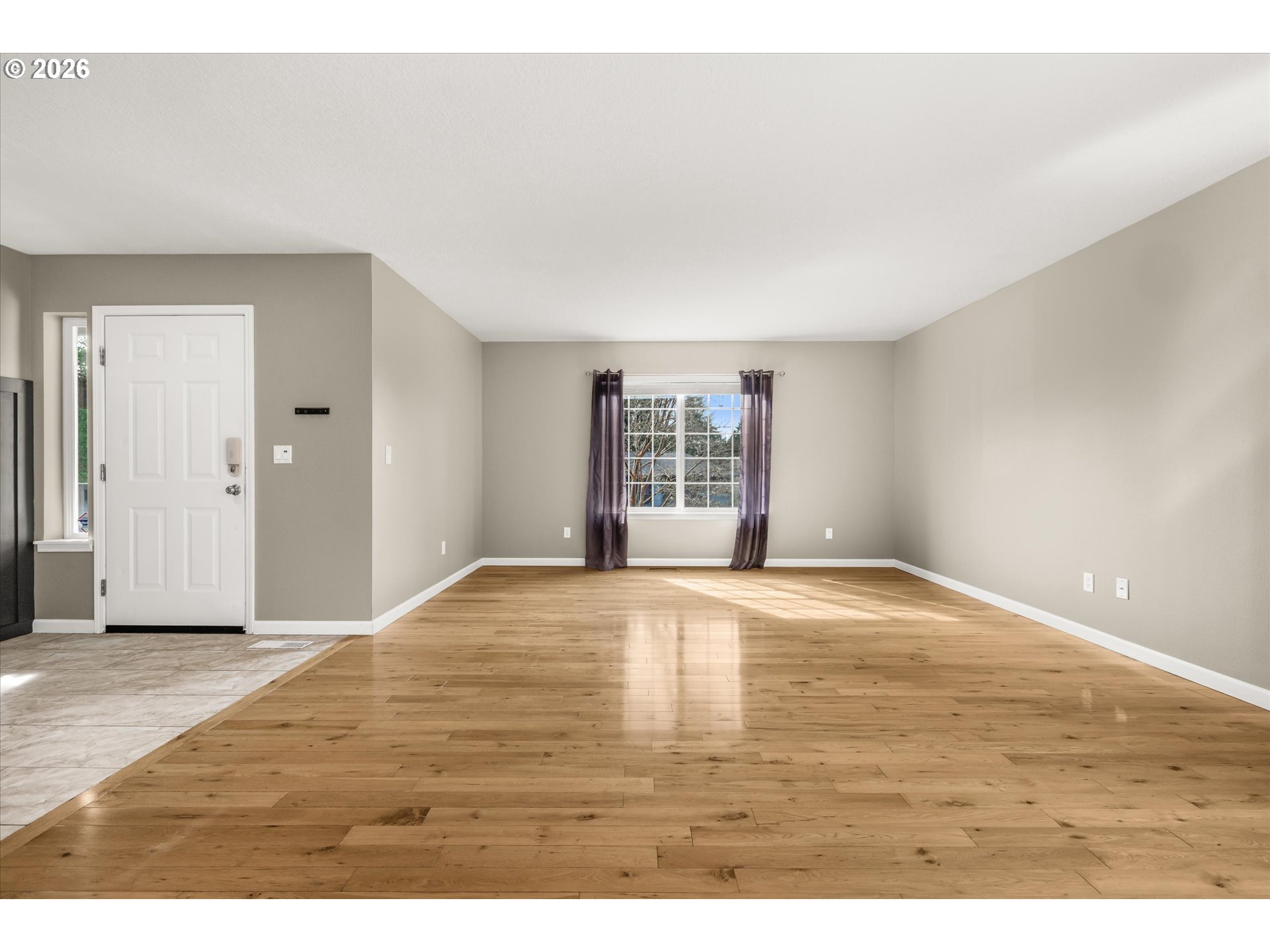 17200 Littlepage Avenue Sandy, OR 97055 - Photo 11 of 47 a view of an empty room with wooden floor and a window
