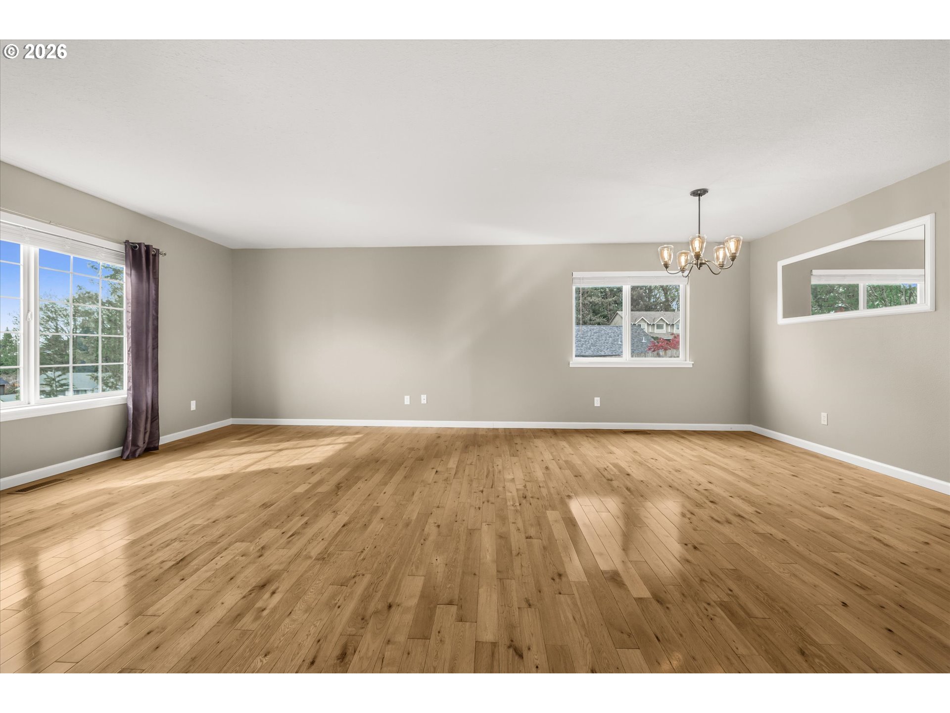 17200 Littlepage Avenue Sandy, OR 97055 - Photo 12 of 47 an empty room with wooden floor and windows
