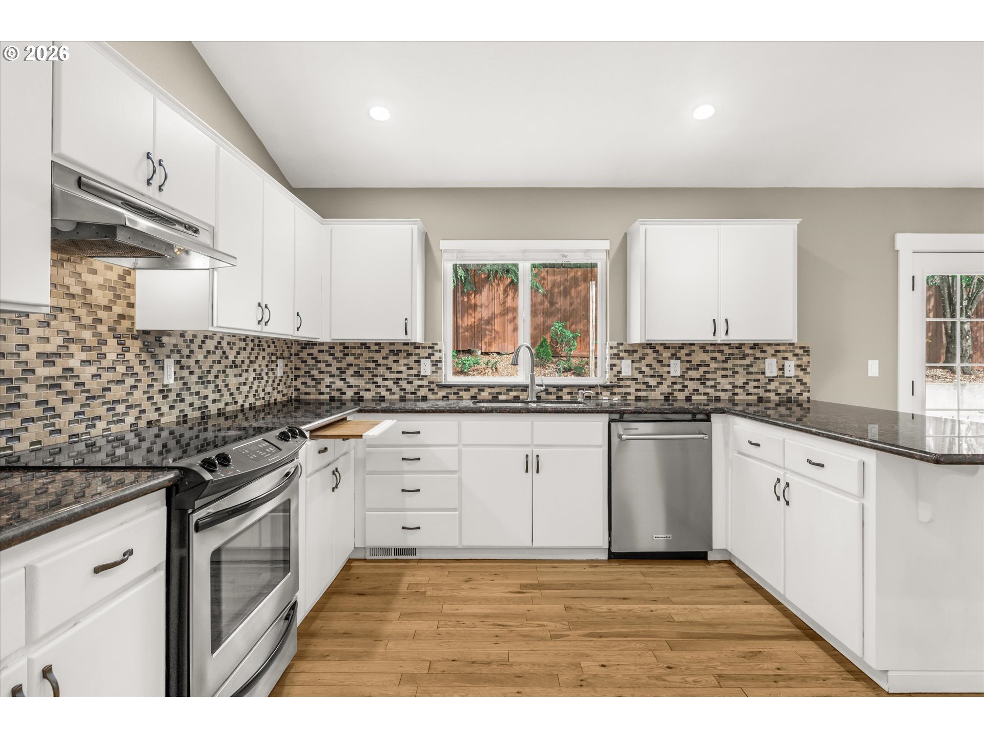 17200 Littlepage Avenue Sandy, OR 97055 - Photo 15 of 47 a kitchen with granite countertop a sink stainless steel appliances and cabinets