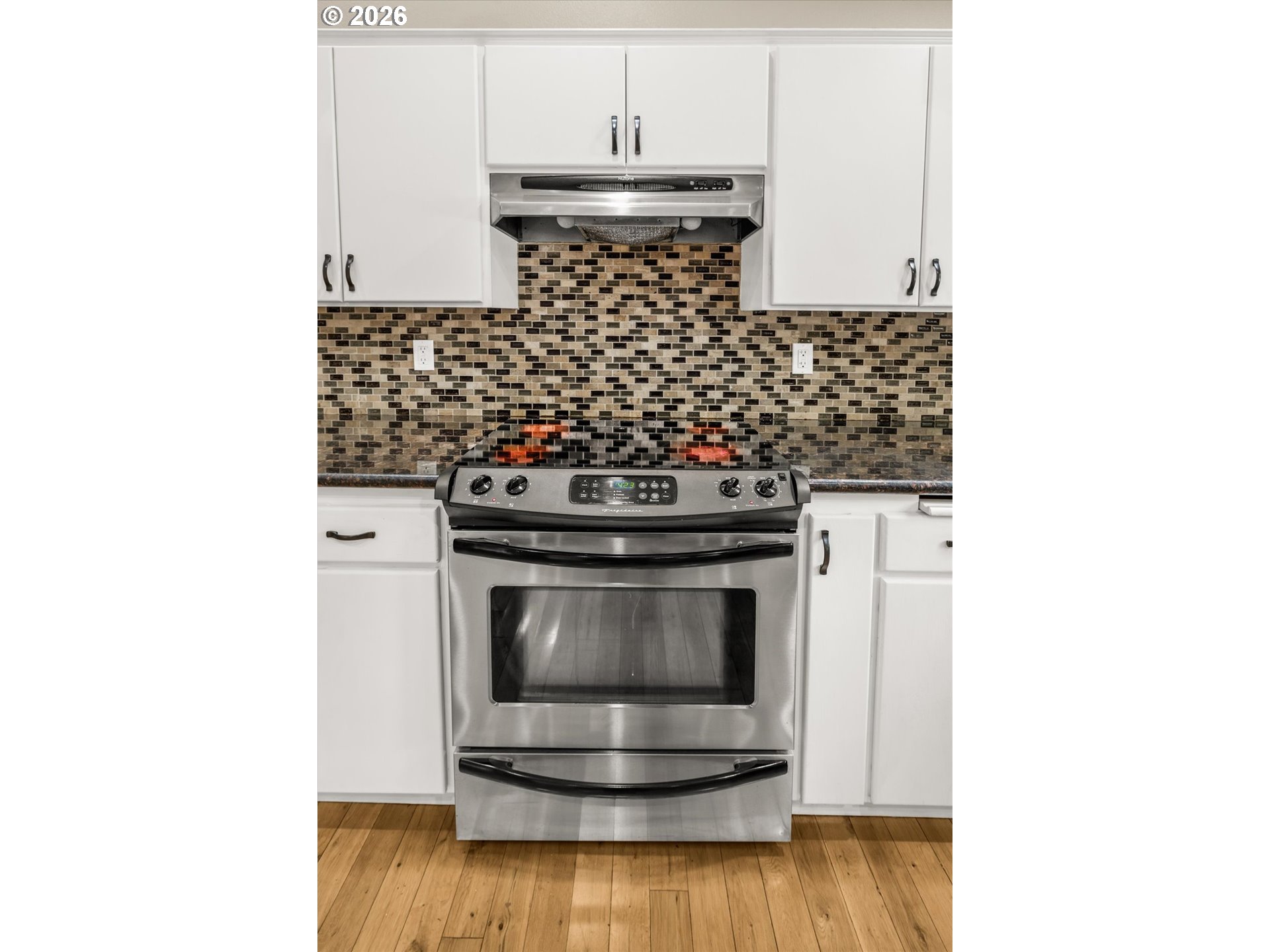 17200 Littlepage Avenue Sandy, OR 97055 - Photo 16 of 47 a stove top oven sitting inside of a kitchen