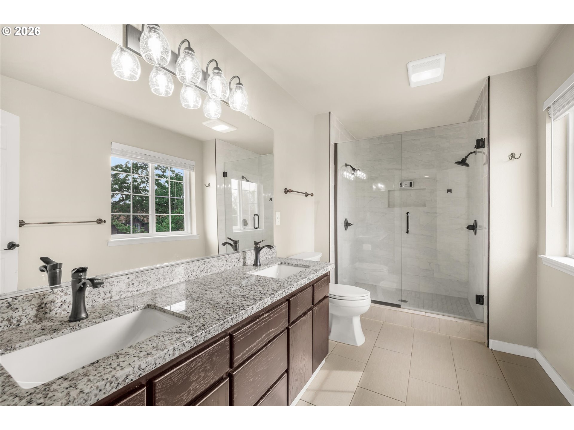 17200 Littlepage Avenue Sandy, OR 97055 - Photo 25 of 47 a bathroom with a granite countertop sink a toilet a mirror a vanity and shower