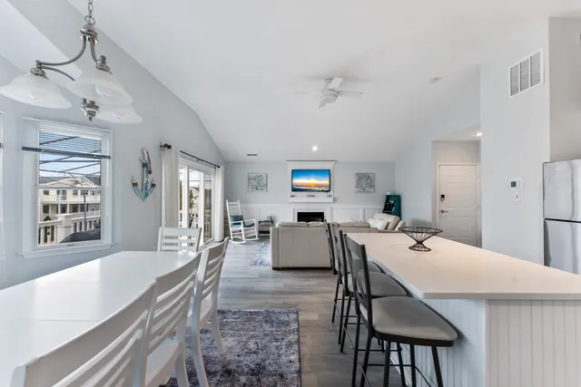 a large white kitchen with a large window