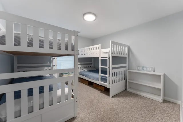 a view of an empty room with a baby crib