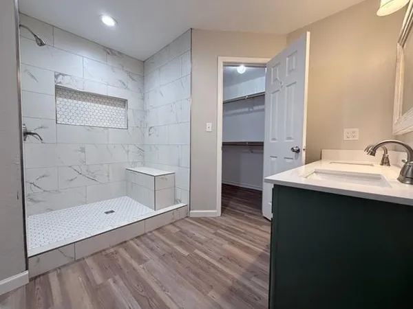 a bathroom with a sink and a mirror