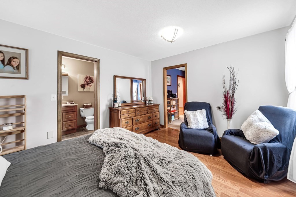 5 Pine Knoll Road Southwick, MA 01077 - Photo 22 of 40 a bedroom with furniture and a wooden floor