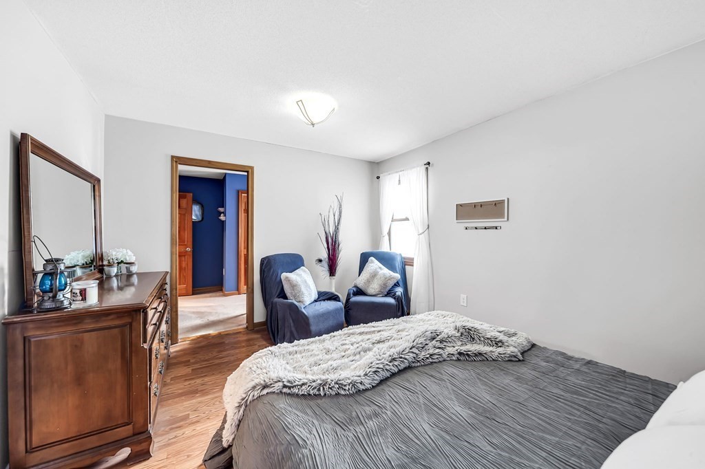 5 Pine Knoll Road Southwick, MA 01077 - Photo 23 of 40 a bedroom with a bed and a couch