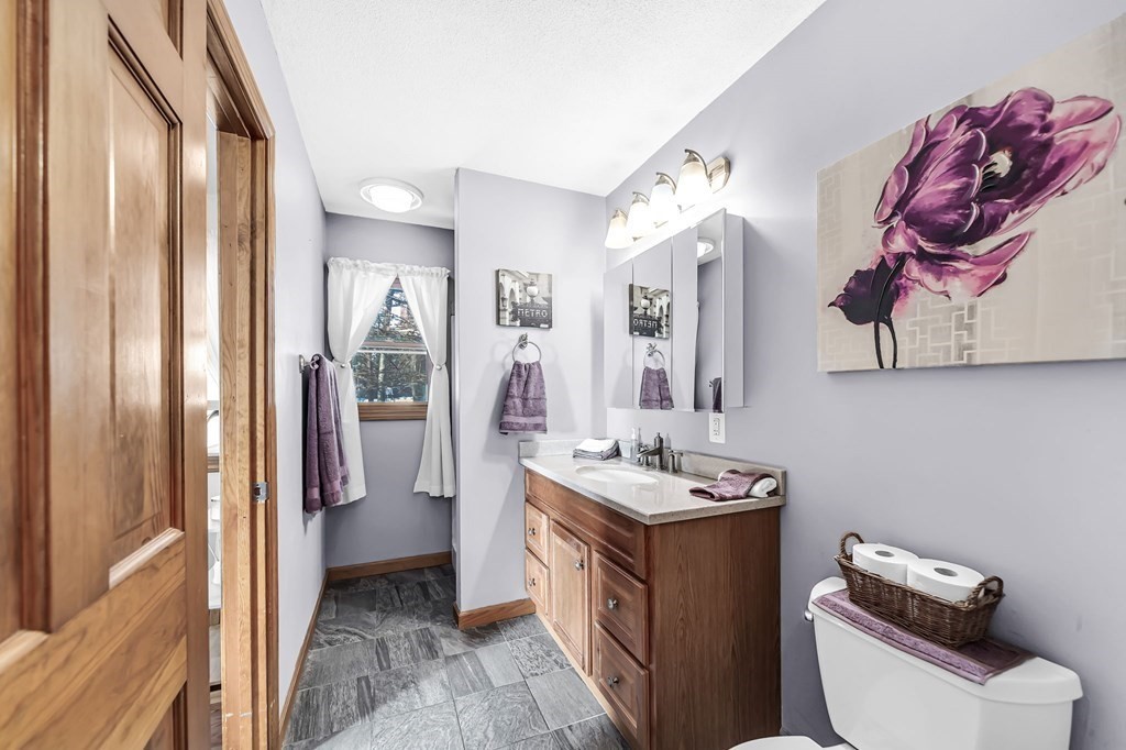 5 Pine Knoll Road Southwick, MA 01077 - Photo 25 of 40 a bathroom with a sink vanity mirror and toilet