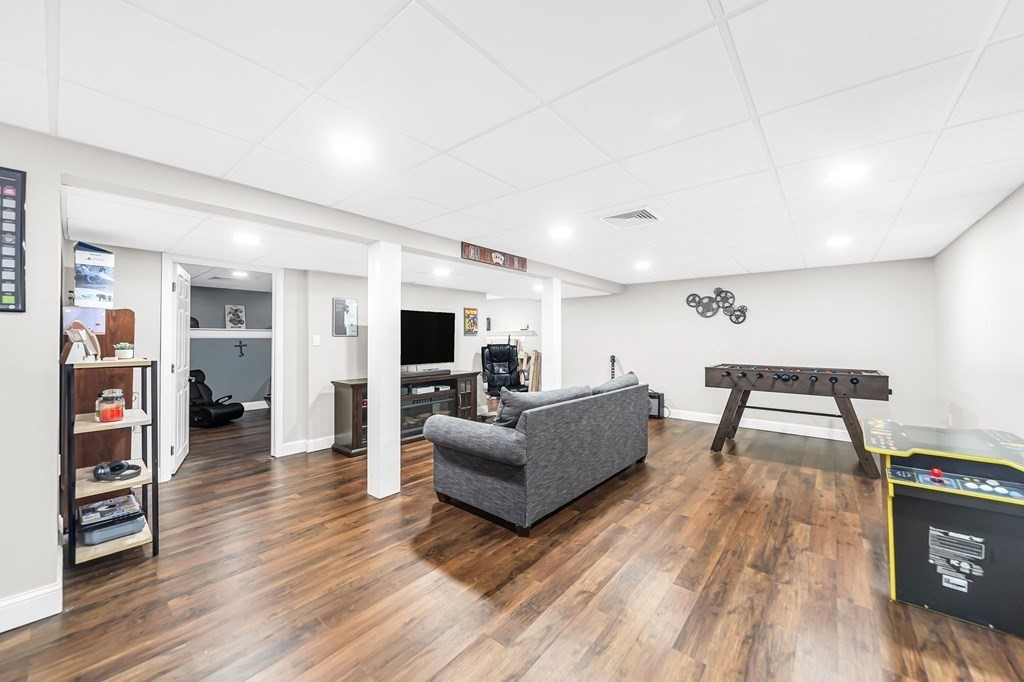 5 Pine Knoll Road Southwick, MA 01077 - Photo 27 of 40 a living room with furniture and a wooden floor