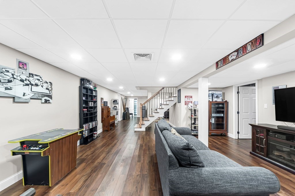 5 Pine Knoll Road Southwick, MA 01077 - Photo 29 of 40 a living room with furniture and a flat screen tv
