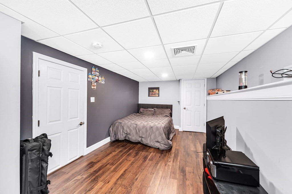 5 Pine Knoll Road Southwick, MA 01077 - Photo 33 of 40 a bedroom with furniture and wooden floor