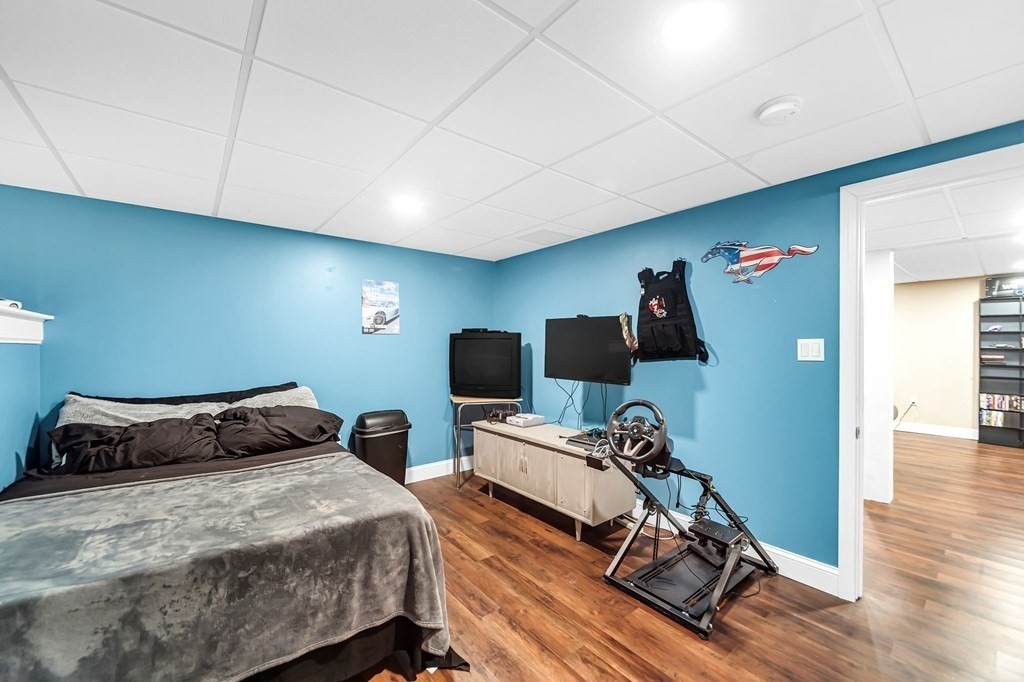 5 Pine Knoll Road Southwick, MA 01077 - Photo 35 of 40 a bedroom with a bed and wooden floor