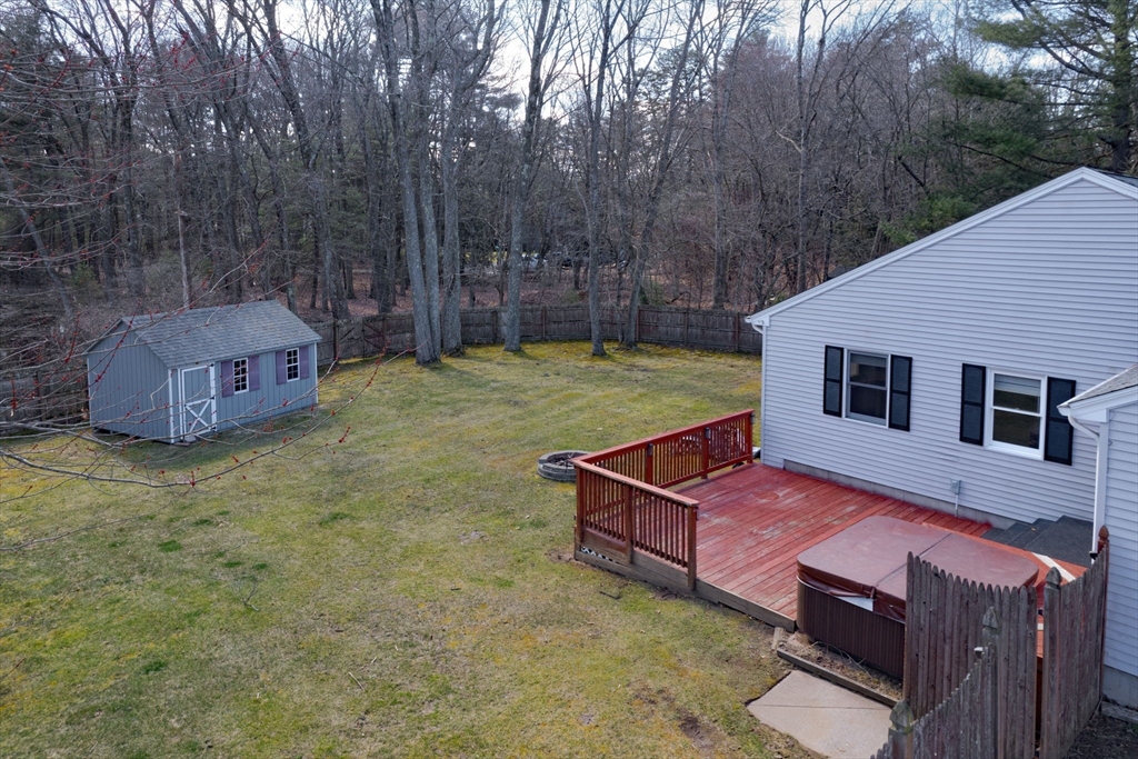 5 Pine Knoll Road Southwick, MA 01077 - Photo 39 of 40 a backyard of a house with table and chairs