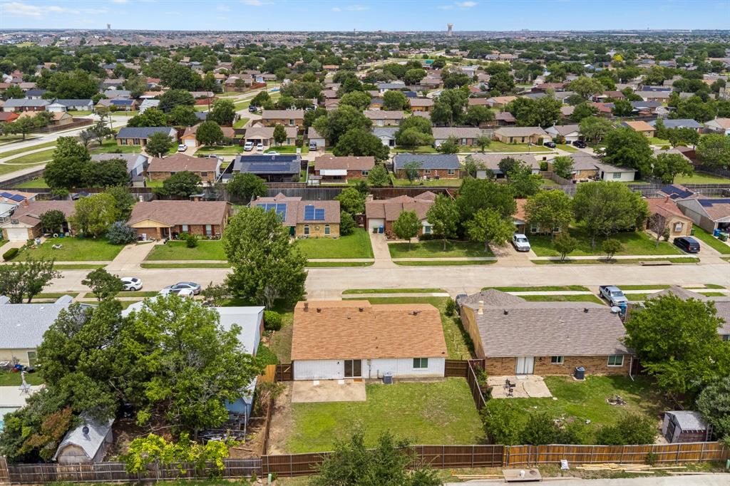 5620 Perrin Street The Colony, TX 75056 - Photo 28 of 31 an aerial view of a house with a yard