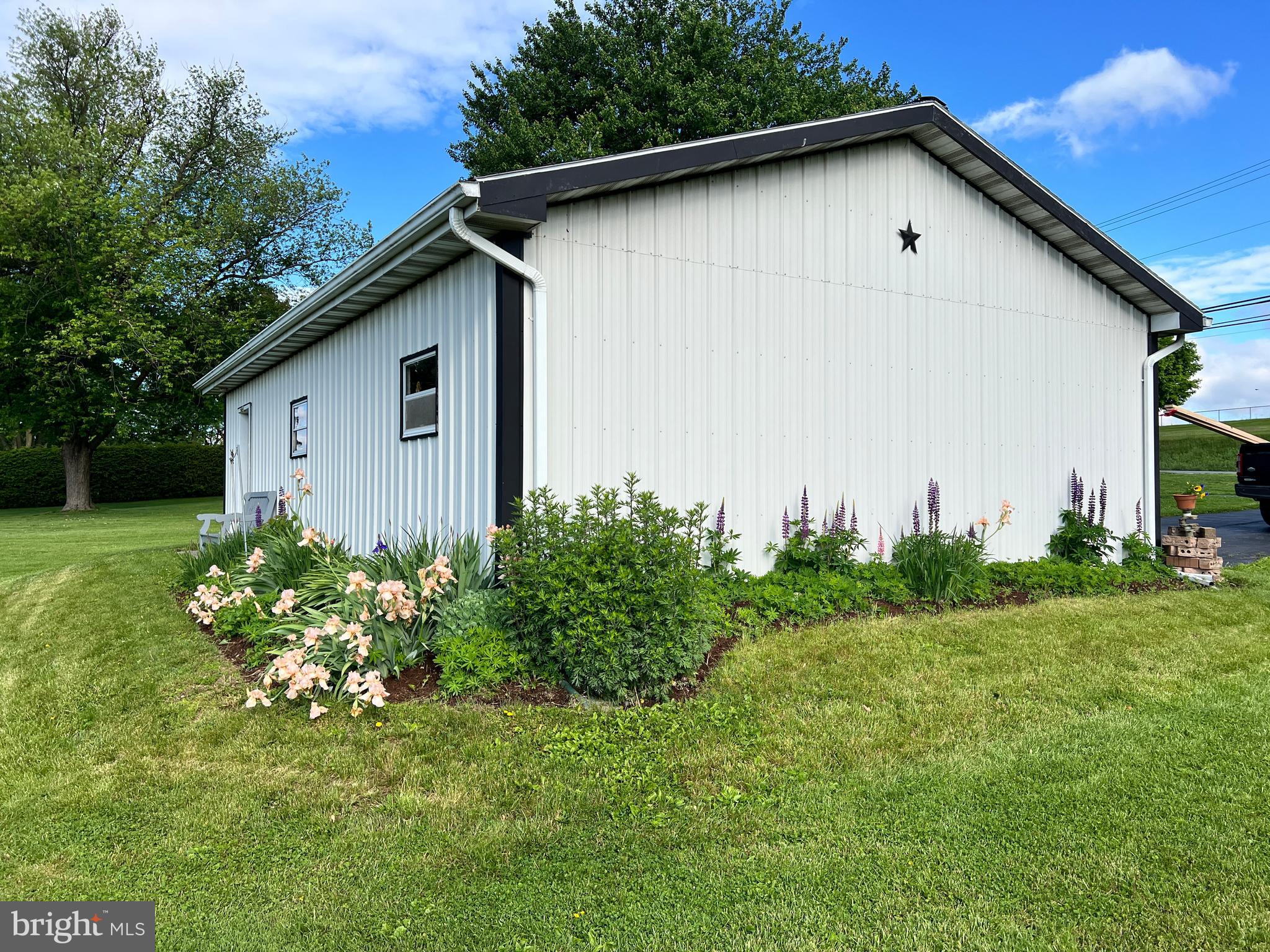 252 Doe Run Road Manheim, PA 17545 - Photo 23 of 32 a house with green field in front of it