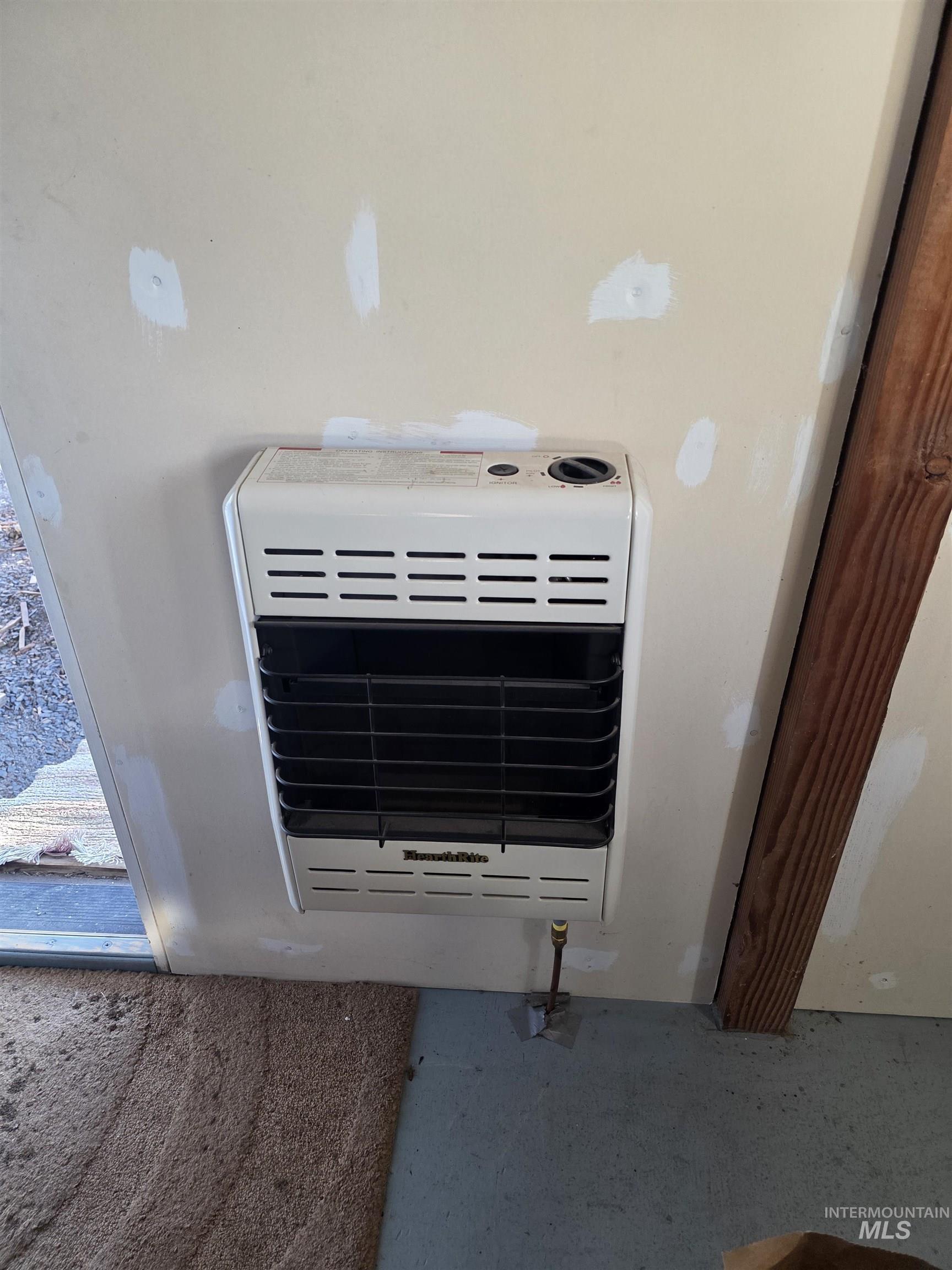 407 Memory Lane Orofino, ID 83544 - Photo 5 of 18 Detailed view of heating unit and carpet