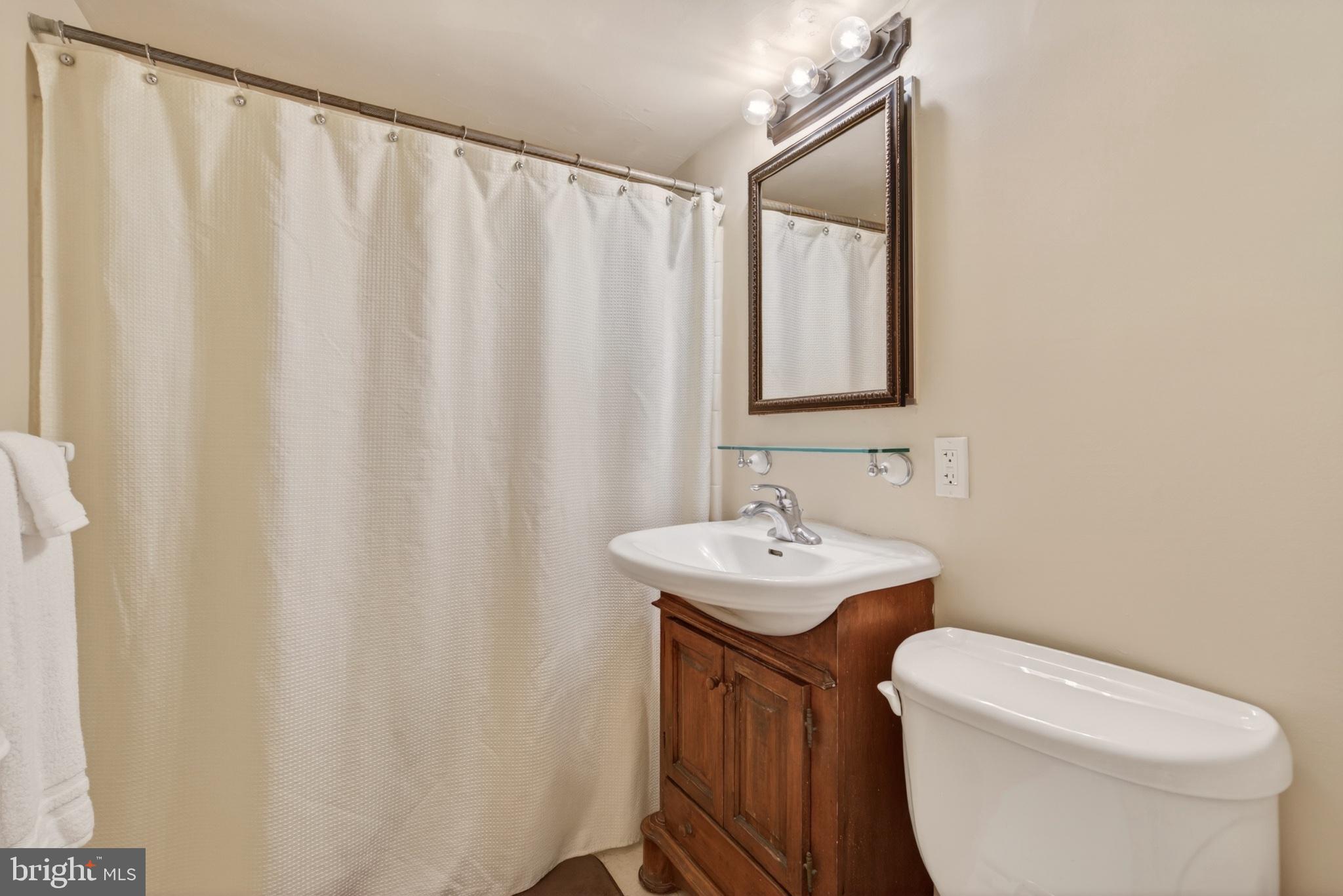 11 2nd Street Northeast, Unit 108 Washington, DC 20002 - Photo 13 of 18 Charming bathroom with classic touches.