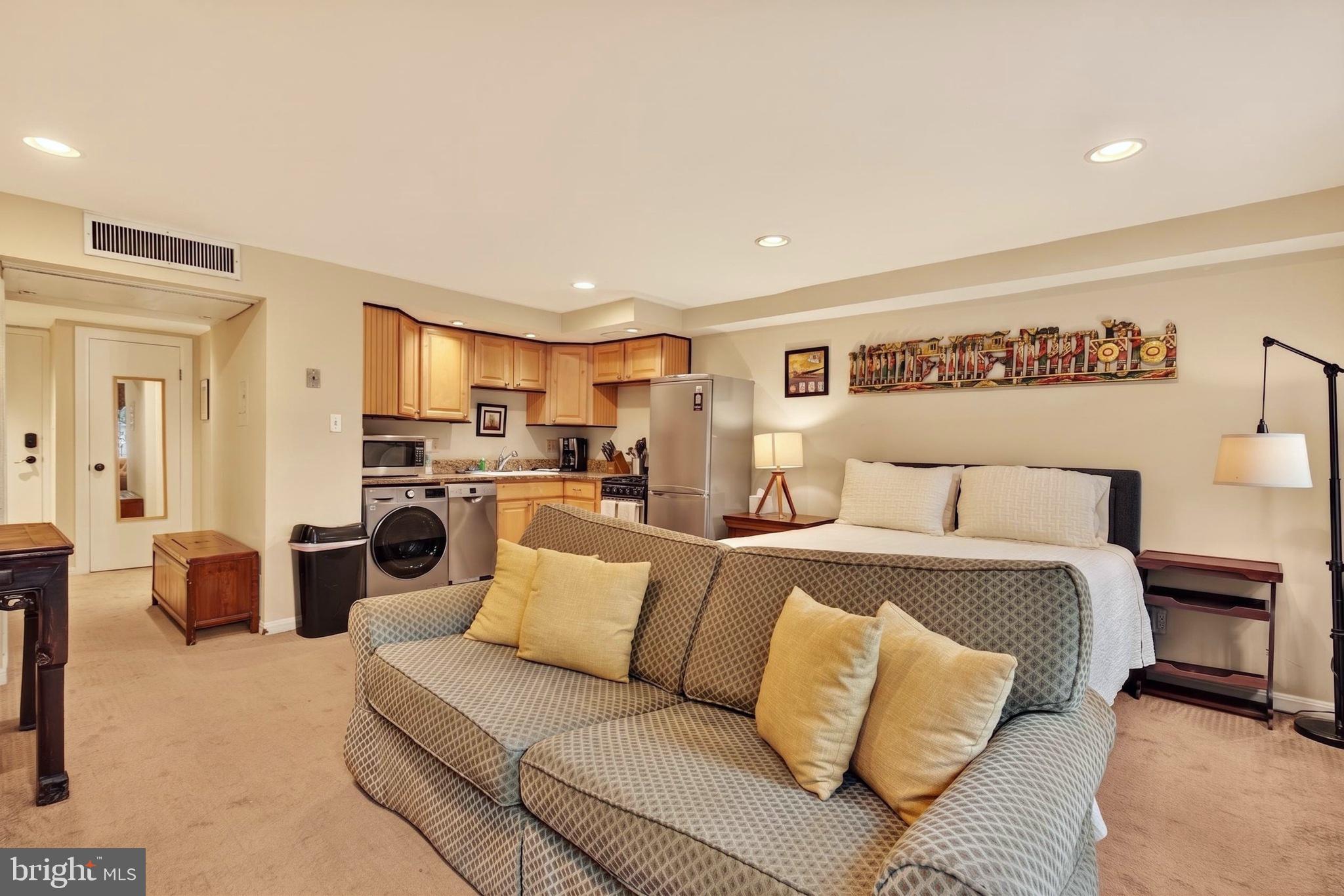 11 2nd Street Northeast, Unit 108 Washington, DC 20002 - Photo 5 of 18 Cozy living space with modern kitchen.