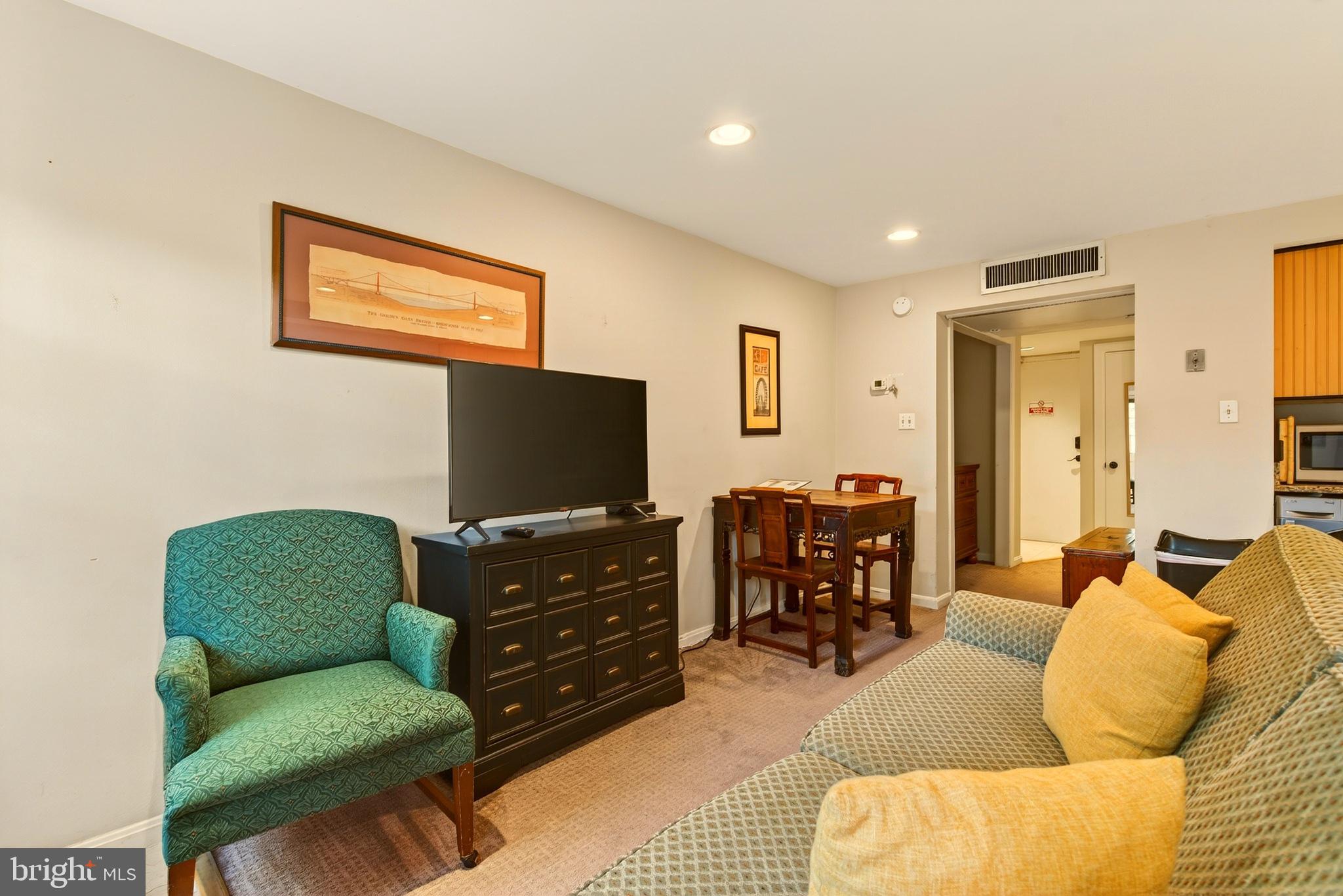 11 2nd Street Northeast, Unit 108 Washington, DC 20002 - Photo 6 of 18 Cozy living space with inviting decor.