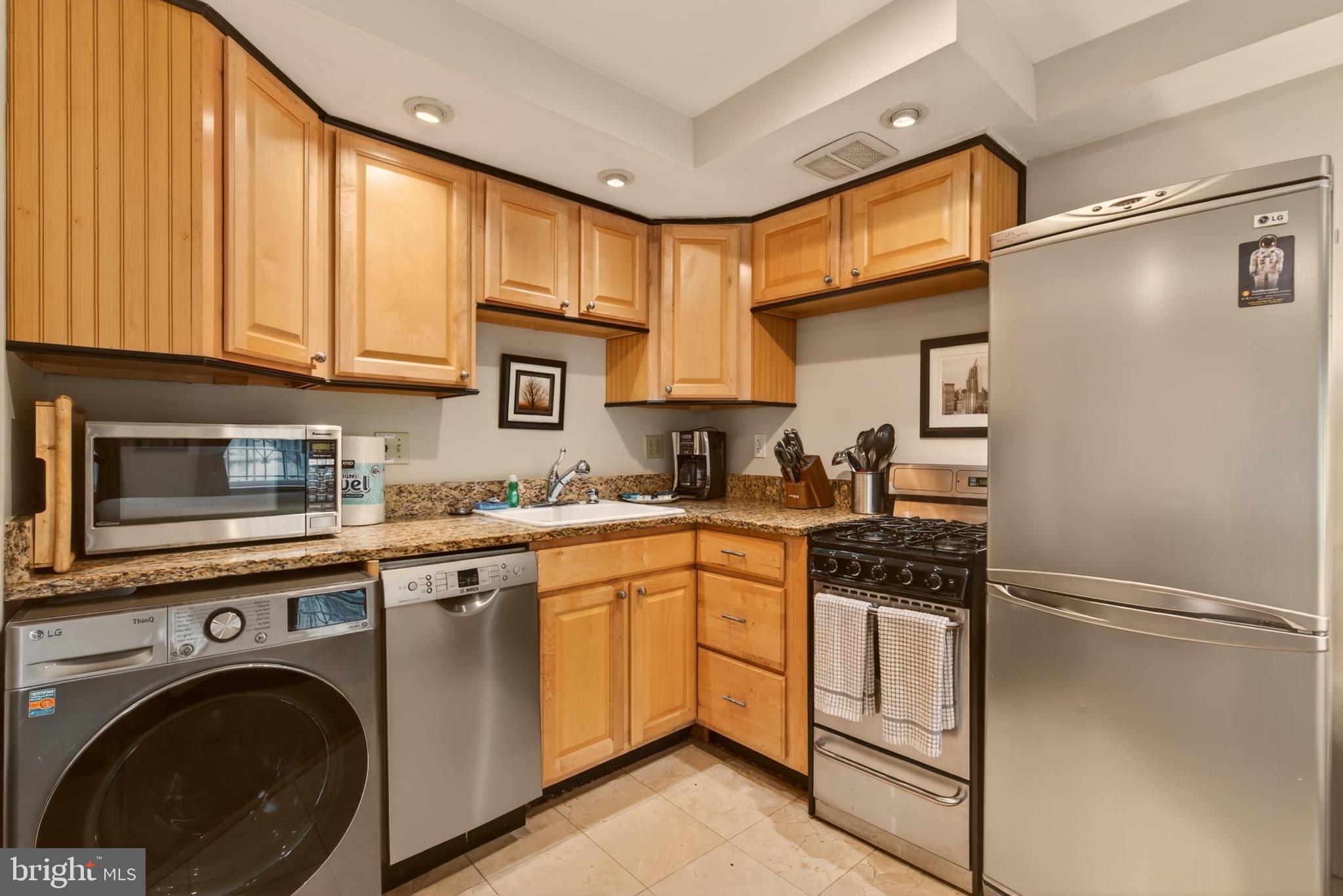 11 2nd Street Northeast, Unit 108 Washington, DC 20002 - Photo 8 of 18 Charming kitchen with modern finishes.