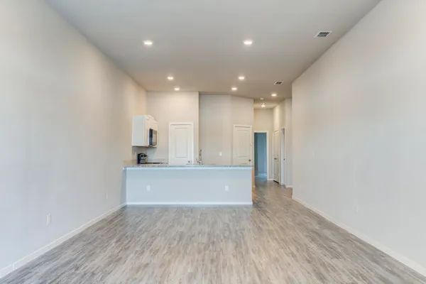 a view of kitchen with wooden floor
