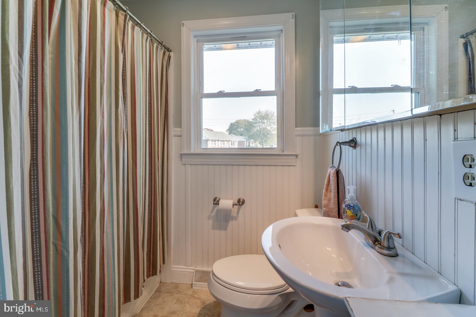 306 South Brownleaf Road Newark, DE 19713 - Photo 18 of 30 a bathroom with a sink a toilet a window and shower
