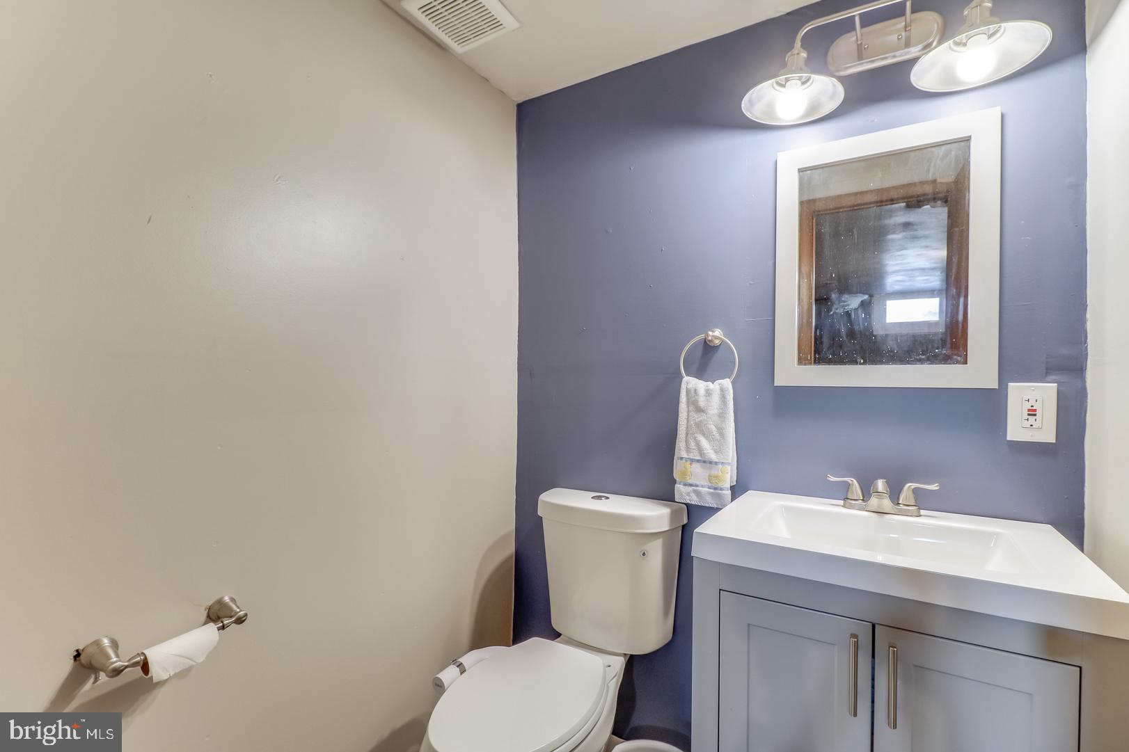 306 South Brownleaf Road Newark, DE 19713 - Photo 21 of 30 a bathroom with a toilet sink and mirror
