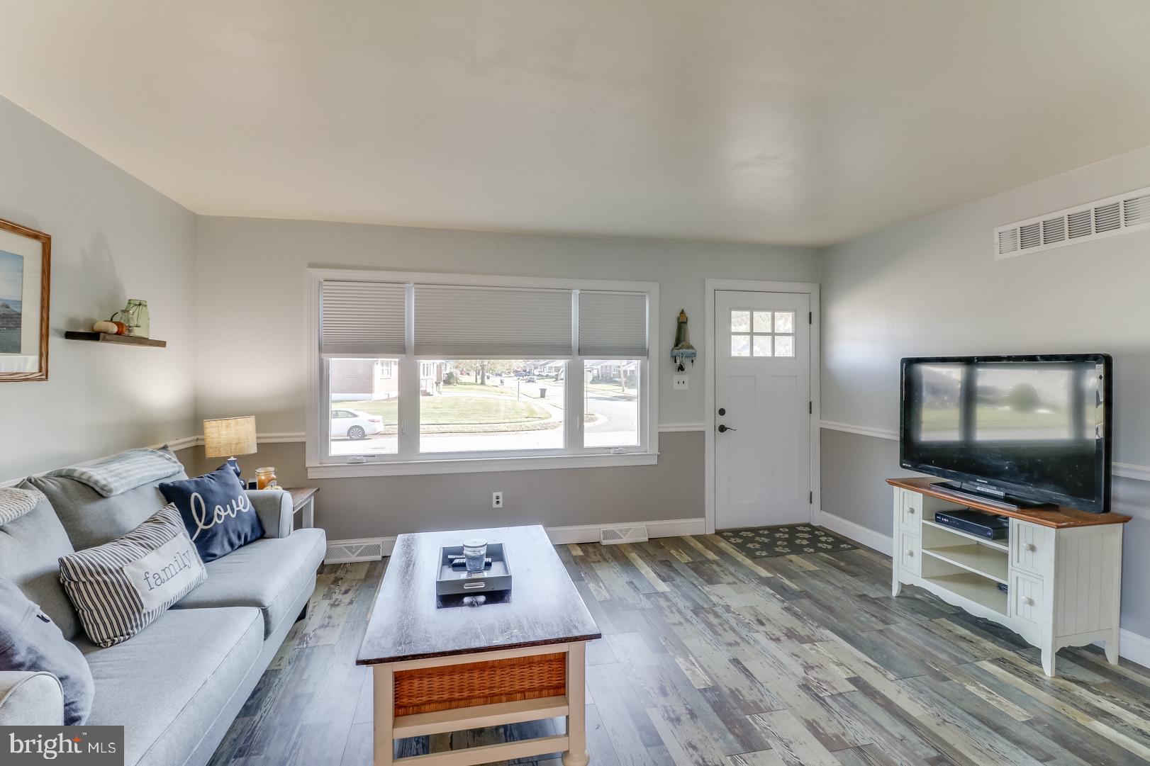 306 South Brownleaf Road Newark, DE 19713 - Photo 4 of 30 a living room with furniture and a flat screen tv