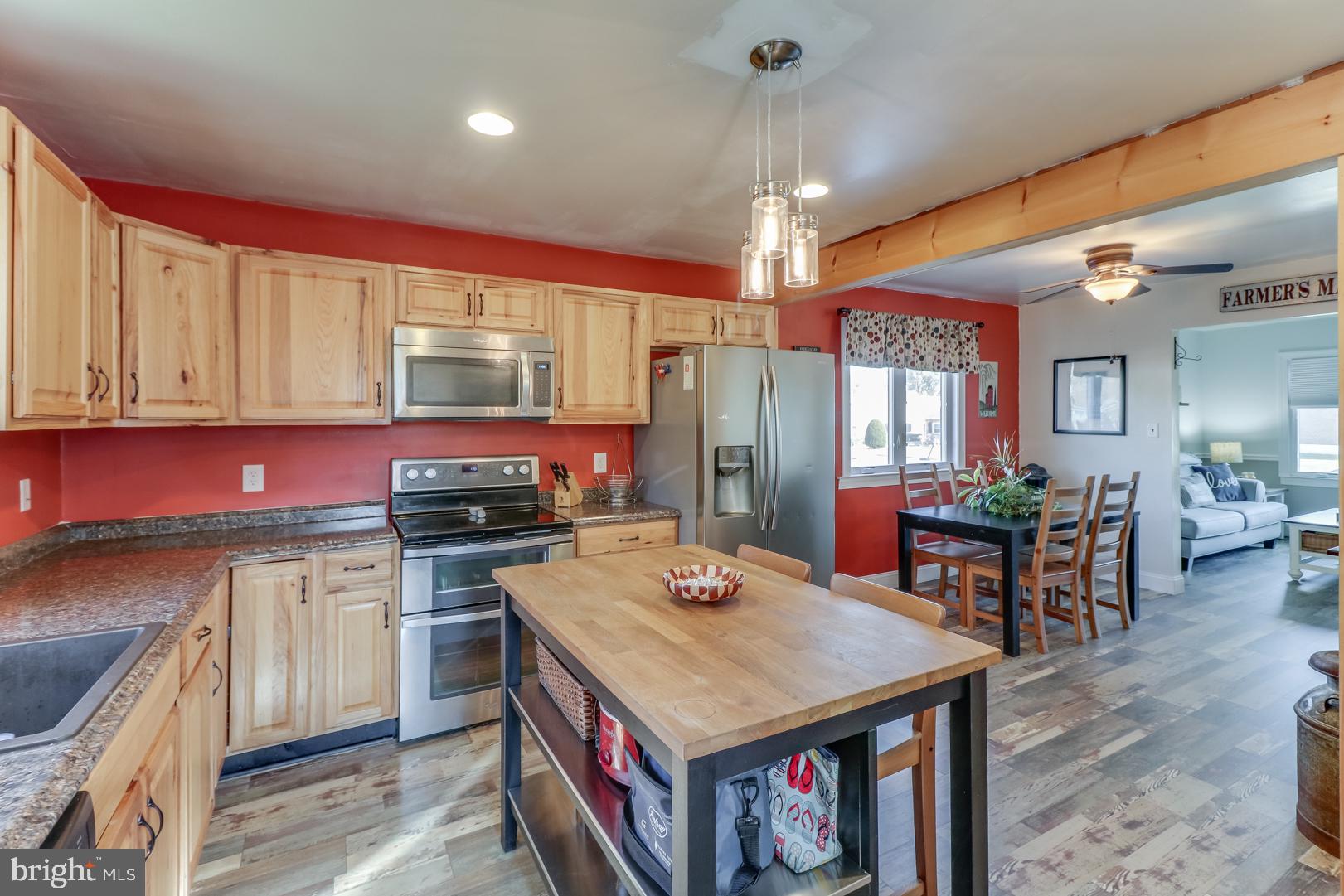 306 South Brownleaf Road Newark, DE 19713 - Photo 10 of 30 a kitchen with a stove a refrigerator and chairs