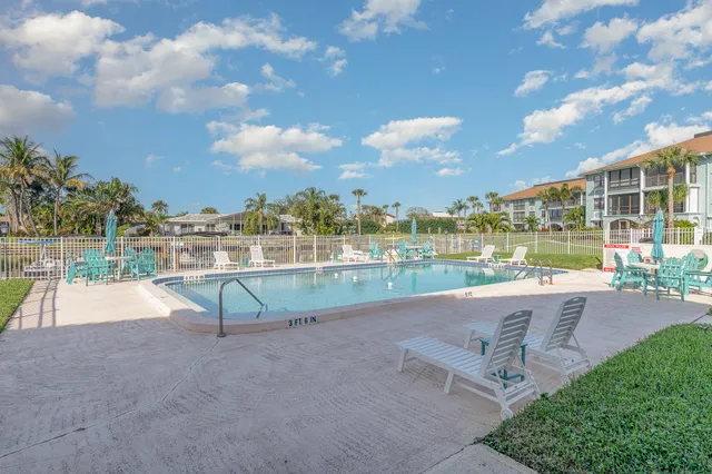 a view of outdoor space with swimming pool and outdoor seating