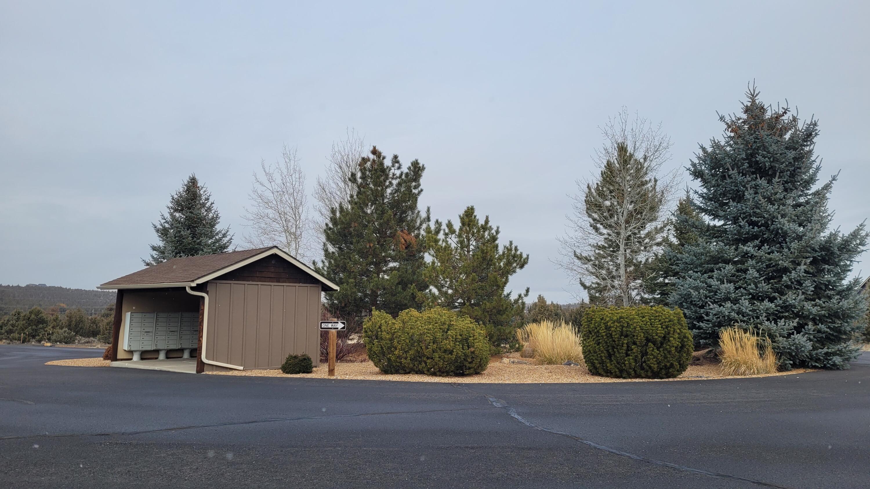 Southeast Ethan Loop, Unit 14 Prineville, OR 97754 - Photo 4 of 17 Covered mailboxes near the front of the community entrance.