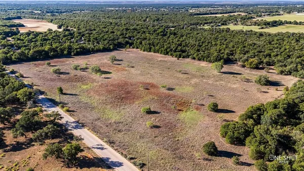 a view of a backyard of the house