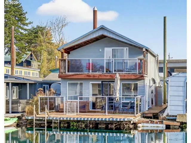 a front view of a residential apartment building with a yard