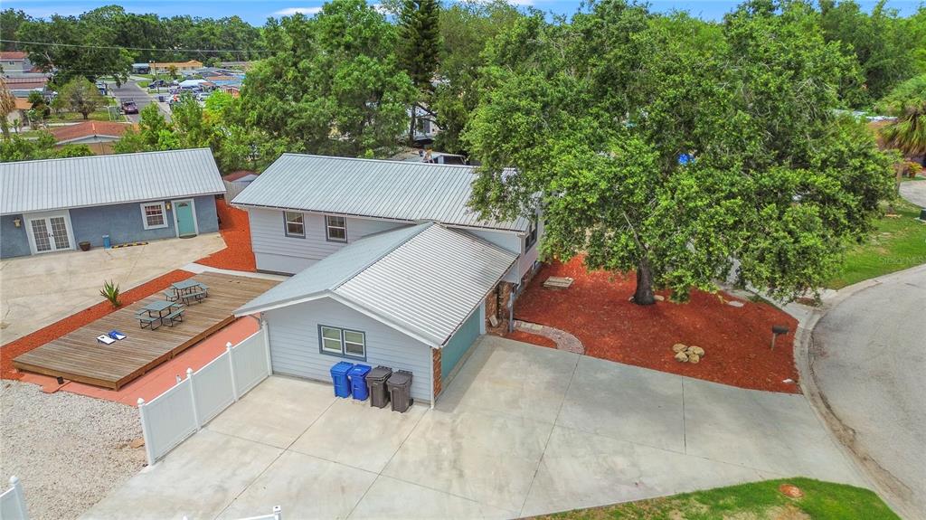6515 Dimarco Road Tampa, FL 33634 - Photo 35 of 66 an aerial view of a house with a yard