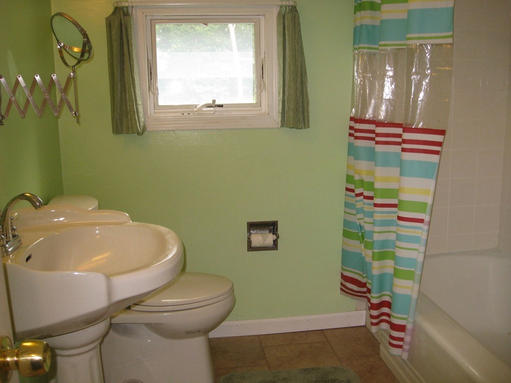 64 Oak Hollow Road Springfield, MA 01128 - Photo 14 of 22 a bathroom with a sink mirror vanity and toilet