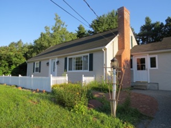 64 Oak Hollow Road Springfield, MA 01128 - Photo 2 of 22 a front view of a house with garden
