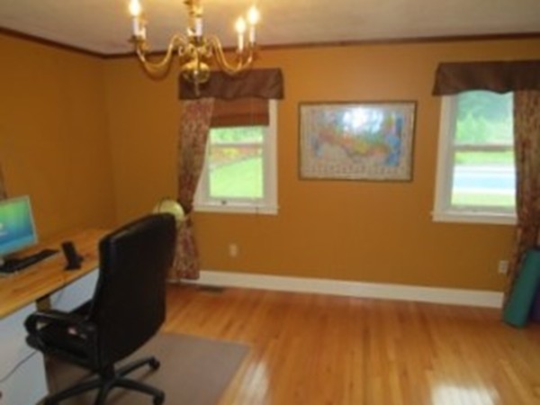 64 Oak Hollow Road Springfield, MA 01128 - Photo 7 of 22 a view of a workspace with furniture and a window