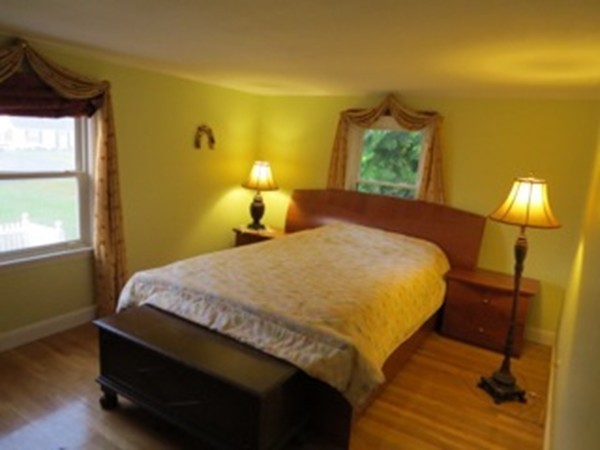 64 Oak Hollow Road Springfield, MA 01128 - Photo 8 of 22 a bed sitting in a bedroom next to a window