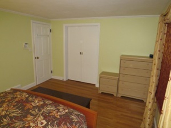 64 Oak Hollow Road Springfield, MA 01128 - Photo 9 of 22 a bedroom with a bed and a dresser