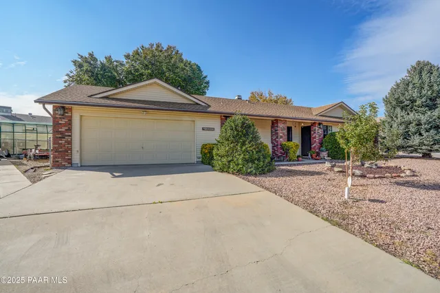 a view of garage and yard