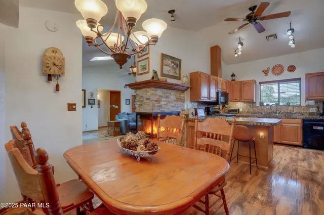 a living room with fireplace furniture and a chandelier
