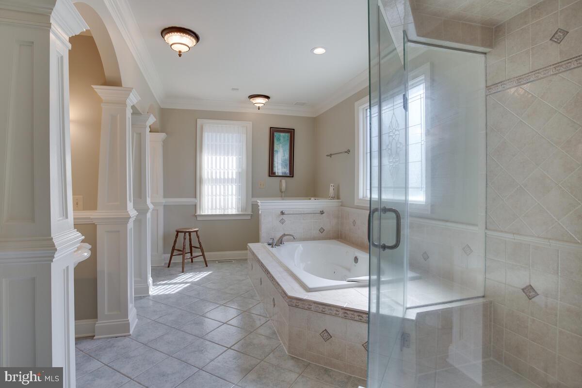 90 Swaggers Point Road Solomons, MD 20688 - Photo 24 of 54 Primary Bathroom has tiled floor and tiled shower