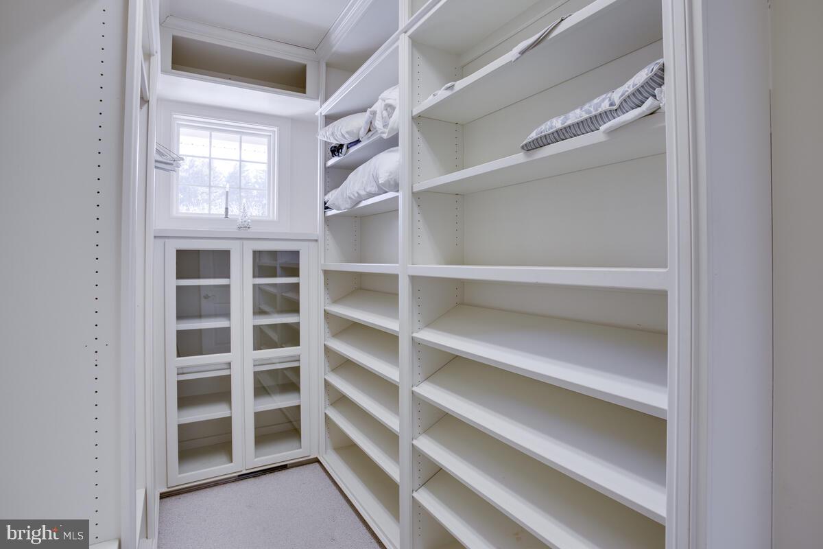 90 Swaggers Point Road Solomons, MD 20688 - Photo 29 of 54 Large walk-In closet has glass cabinet for linens