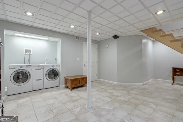 a view of a storage & utility room with washer and dryer