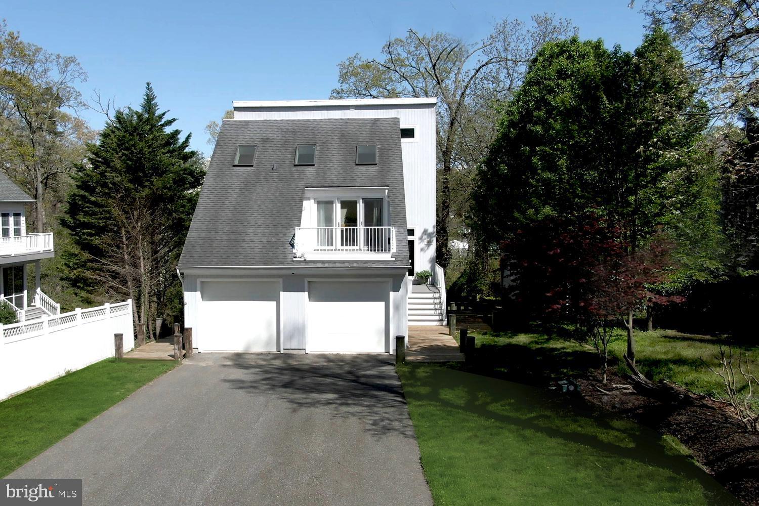 137 Inverness Road Severna Park, MD 21146 - Photo 13 of 46 a front view of a house with a yard and garage