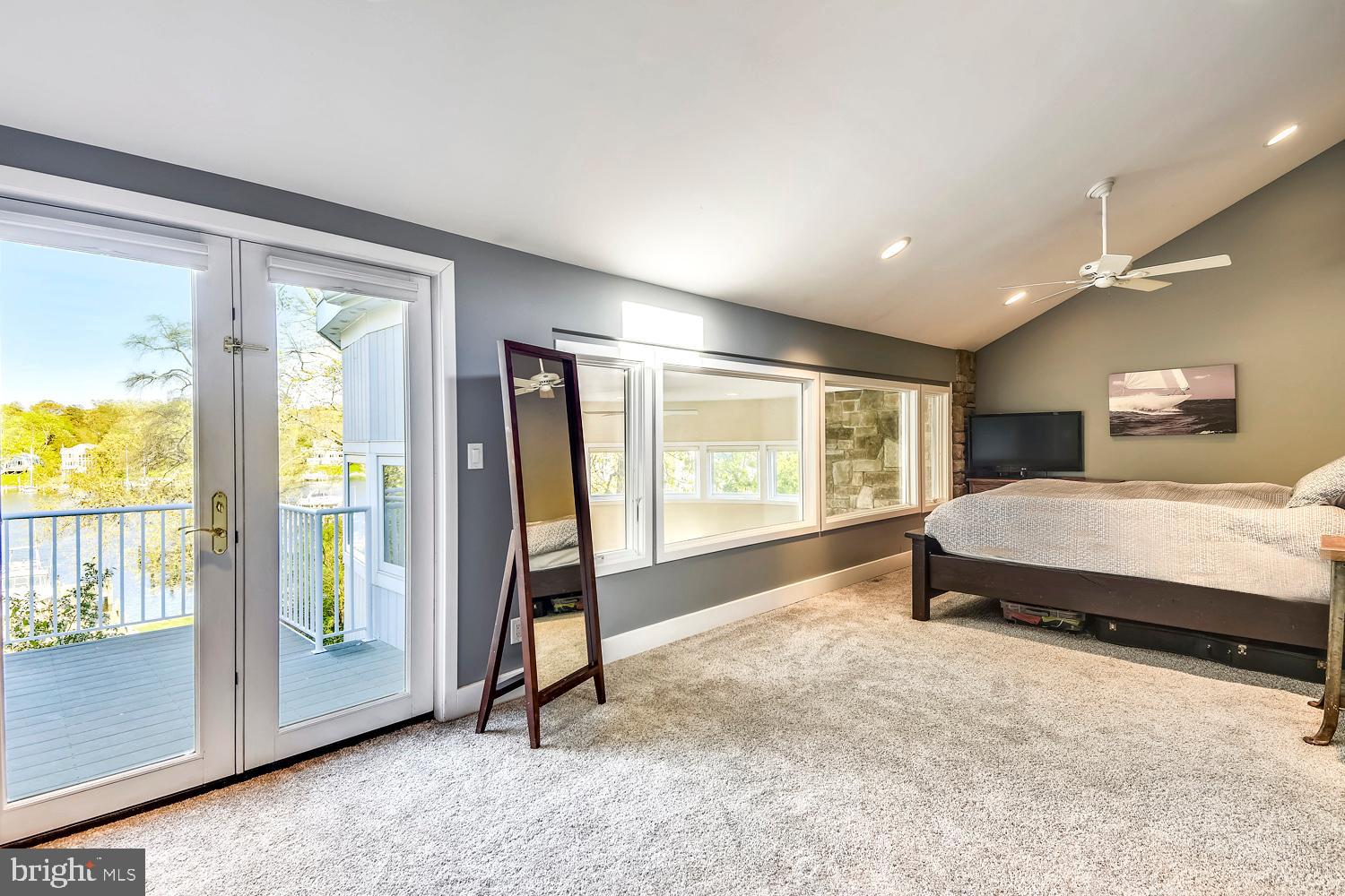 137 Inverness Road Severna Park, MD 21146 - Photo 30 of 46 a spacious bedroom with a large bed and a large window