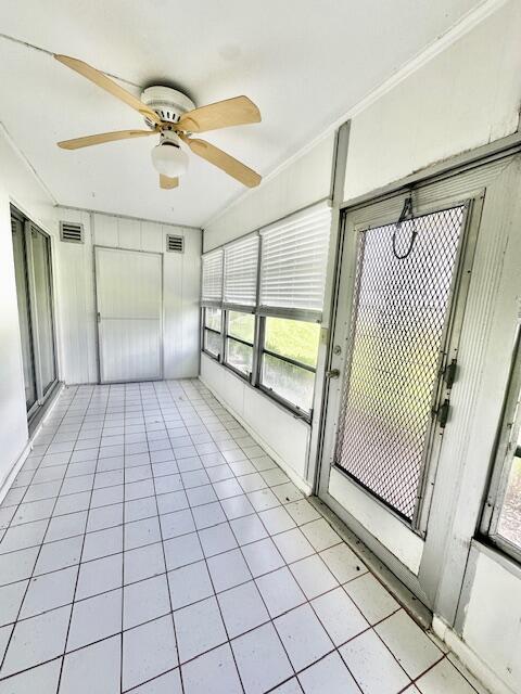 1083 Guildford East Boca Raton, FL 33434 - Photo 11 of 35 Enclosed Patio w/Lake View