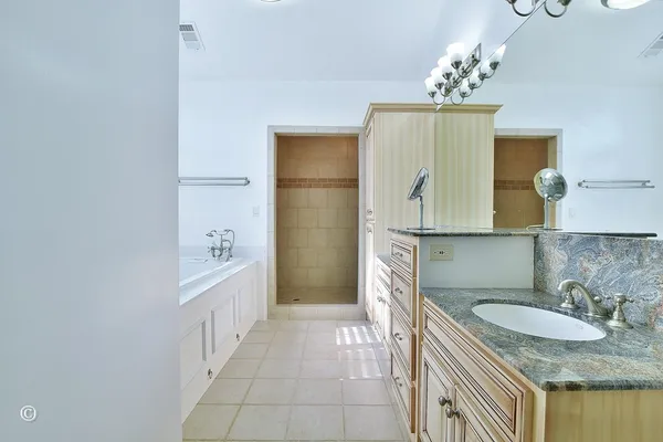 a white bath tub sitting next to a window