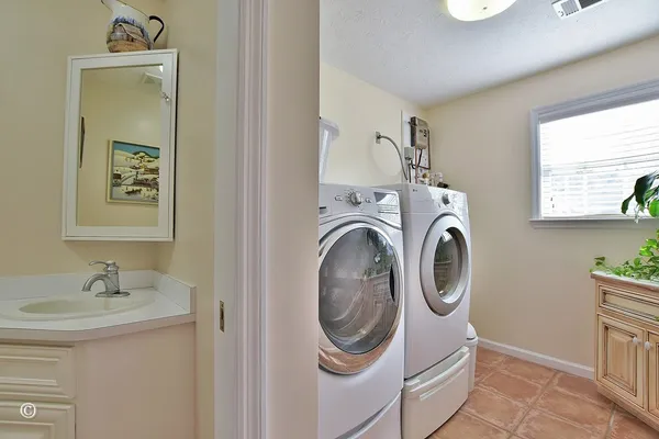 a outdoor dining space with furniture and window